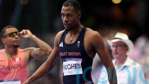 Zharnel Hughes withdraws from 200m heats with ‘hamstring tightness’