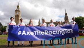 Hollie Doyle and Oisin Murphy stand together in Parliament Square, with racing on strike