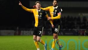 Burton stun Huddersfield to climb out of relegation zone