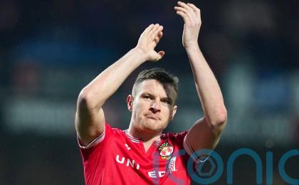 Wrexham striker Paul Mullin set to miss start of season after spinal surgery