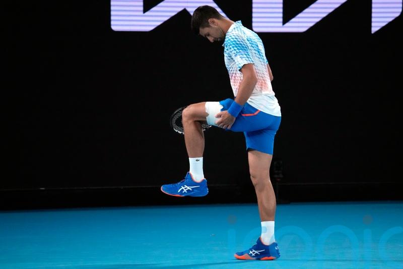 Djokovic taking hamstring injury &lsquo;day to day&rsquo; as he progresses in Melbourne